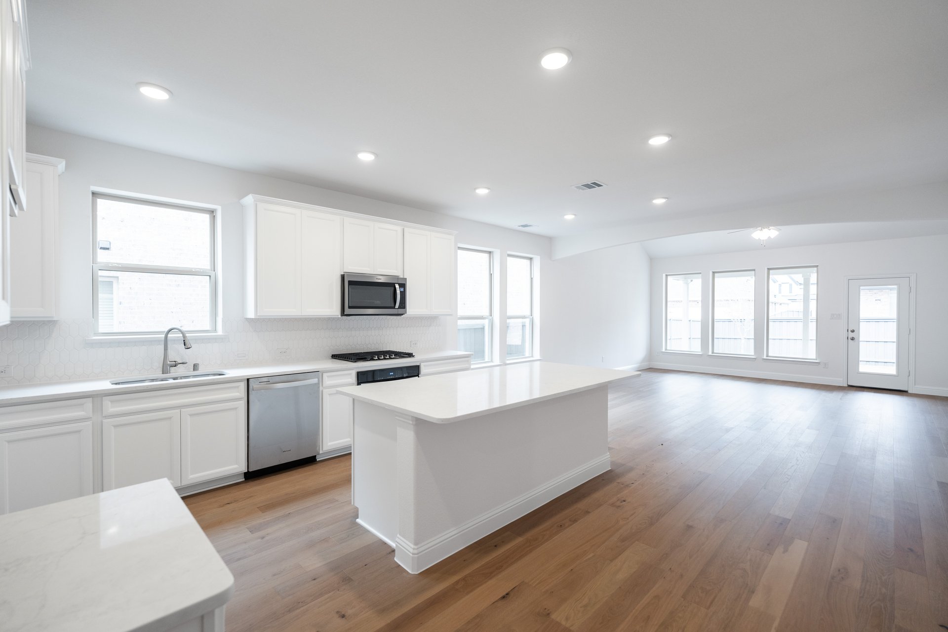 kitchen with large island and white cabinets