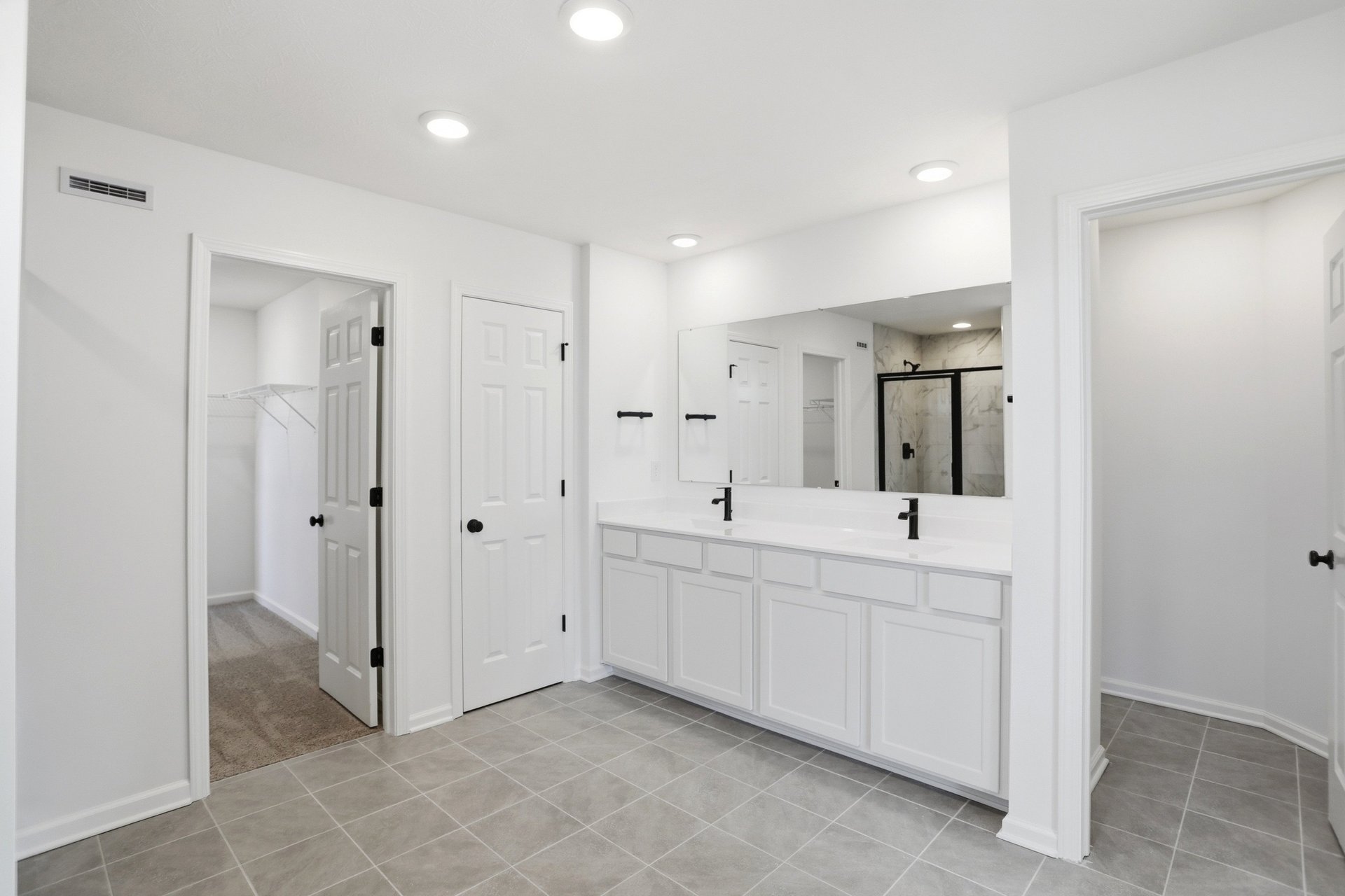 bathroom with white vanity that has dual sinks