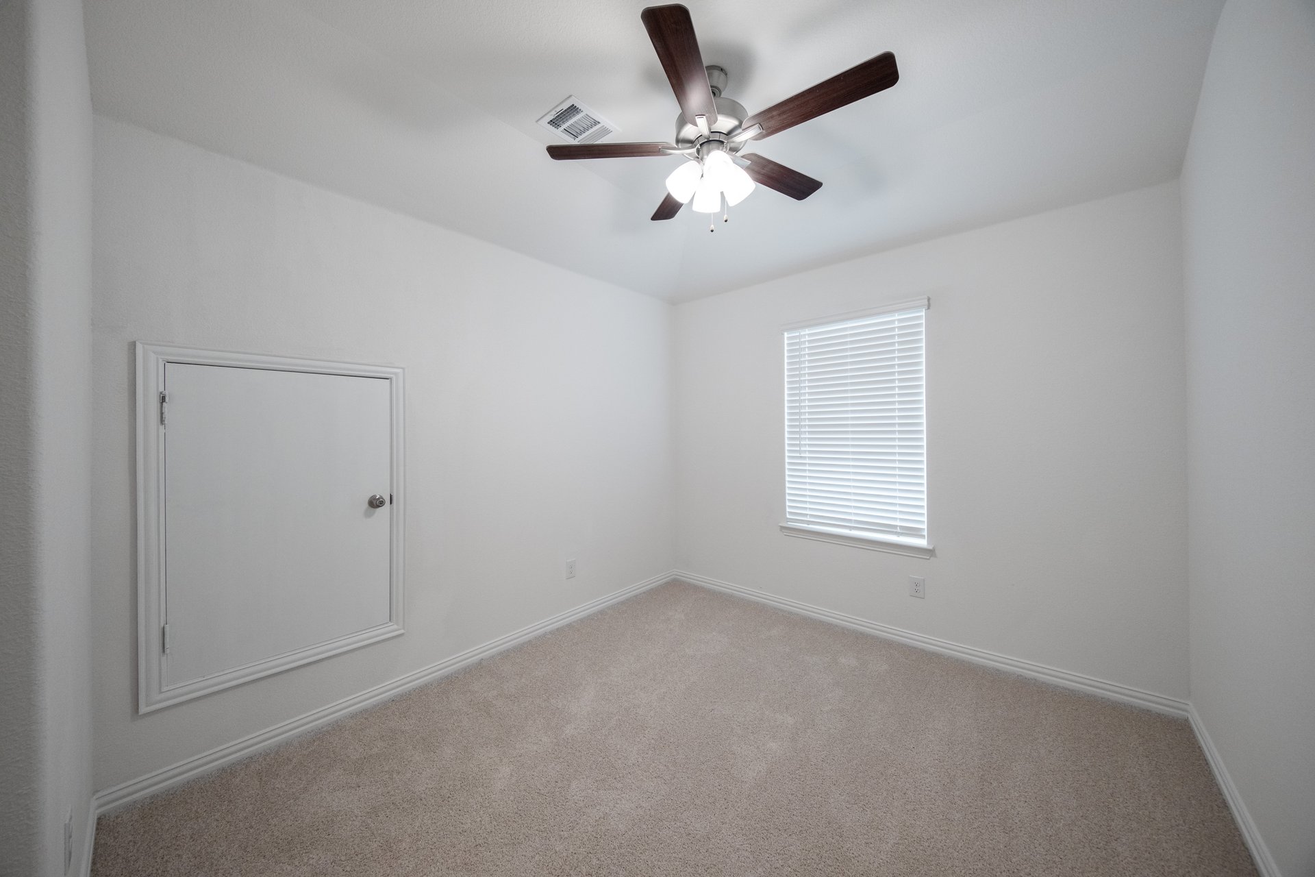 loft with carpet and windows