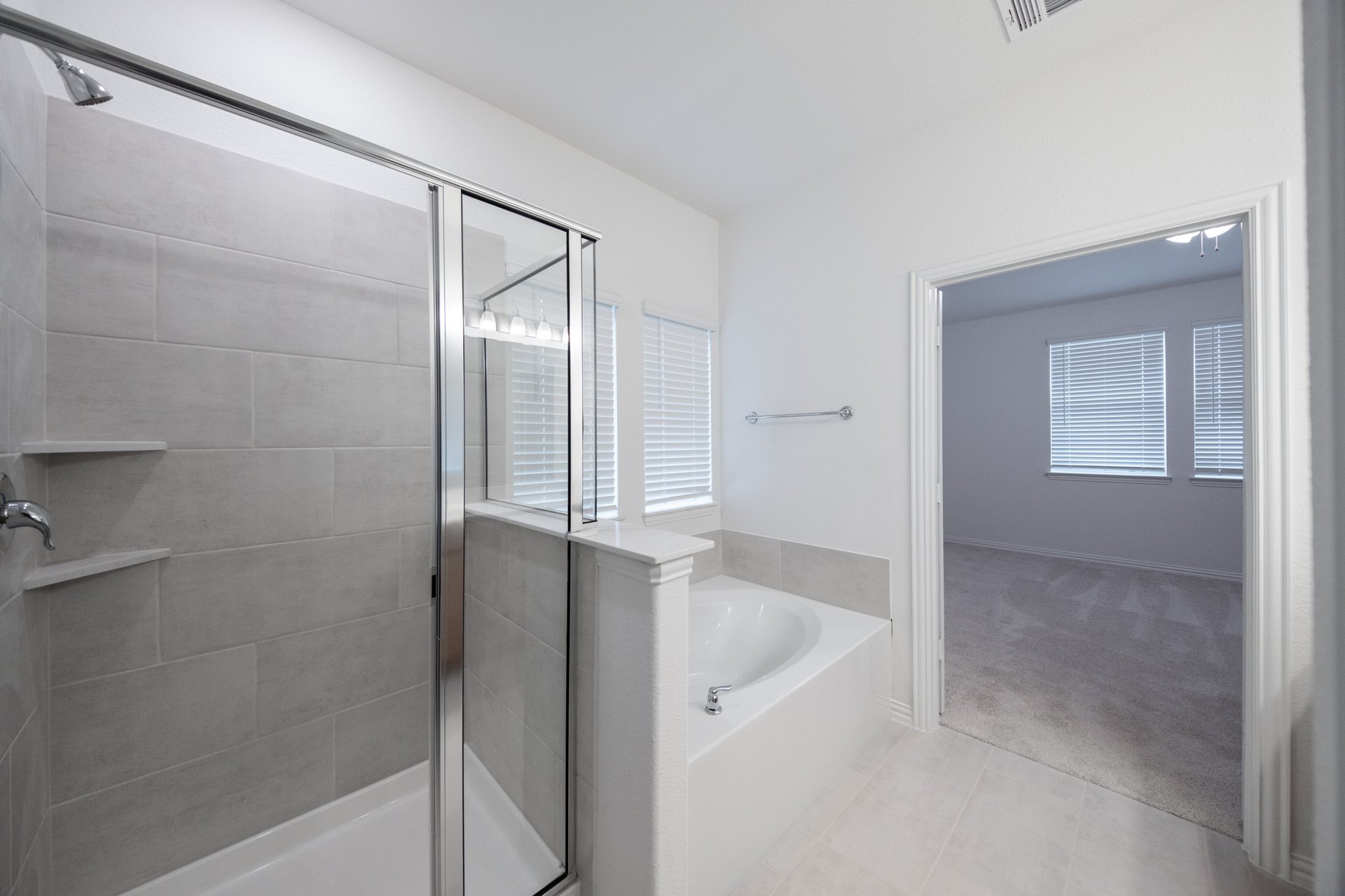 primary bathroom with soaking tub and walk-in shower