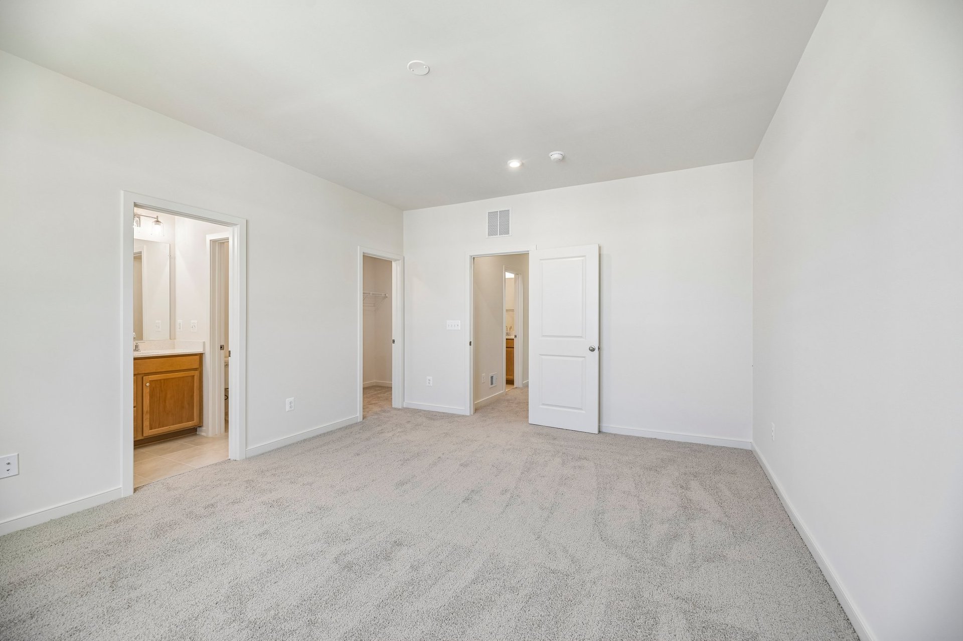 primary bedroom with carpet