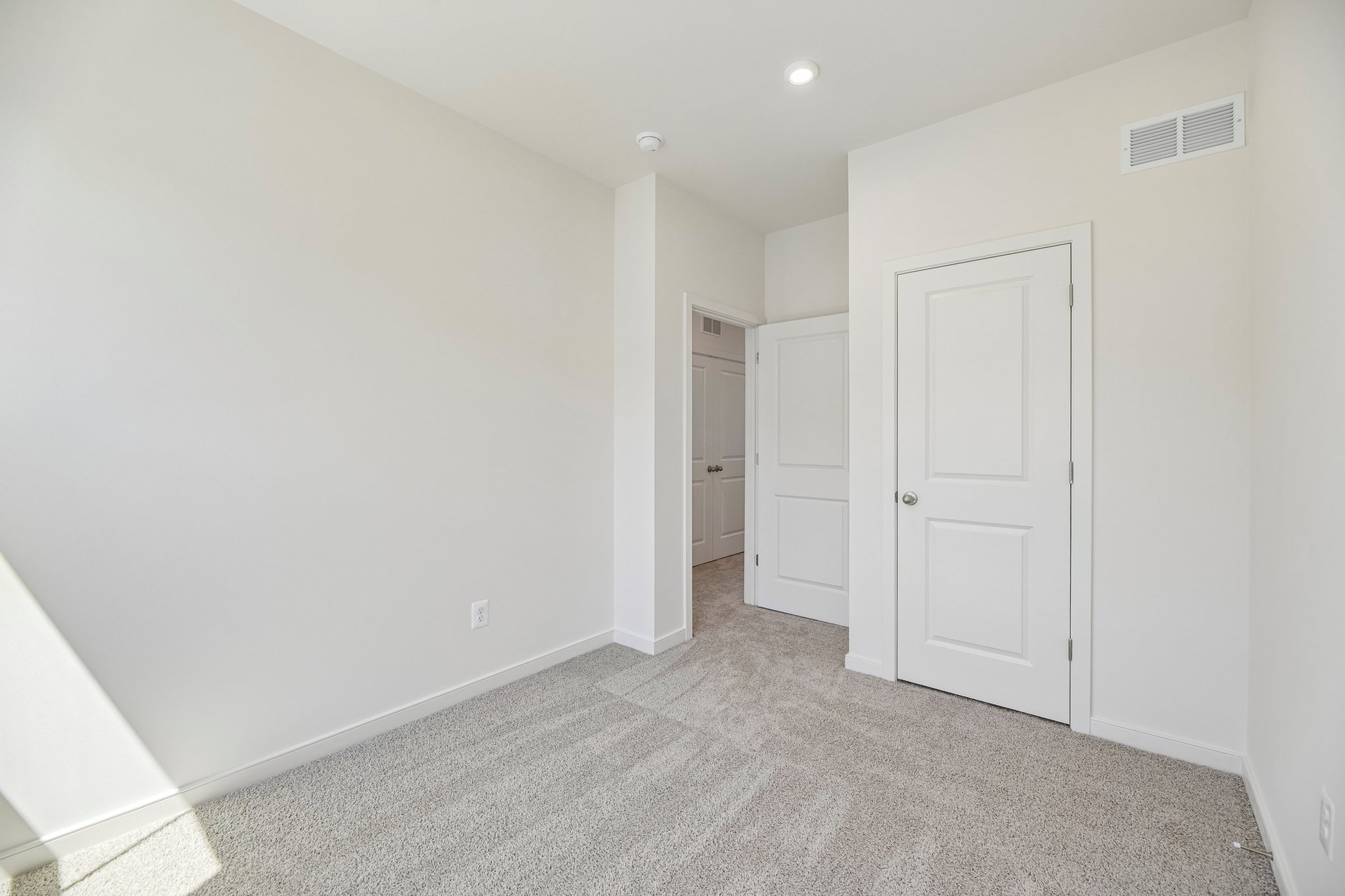 secondary bedroom with carpet