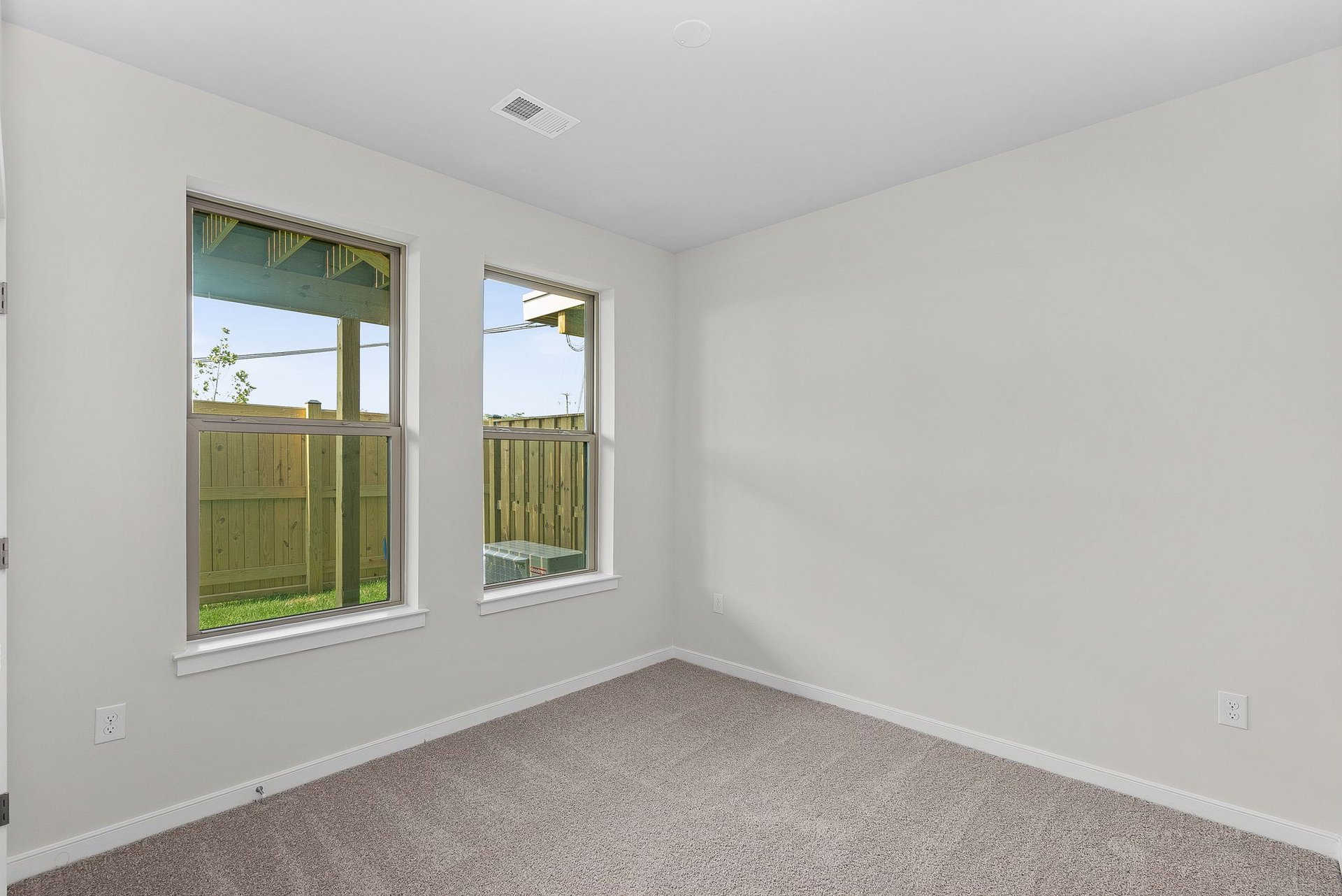 secondary bedroom with two windows
