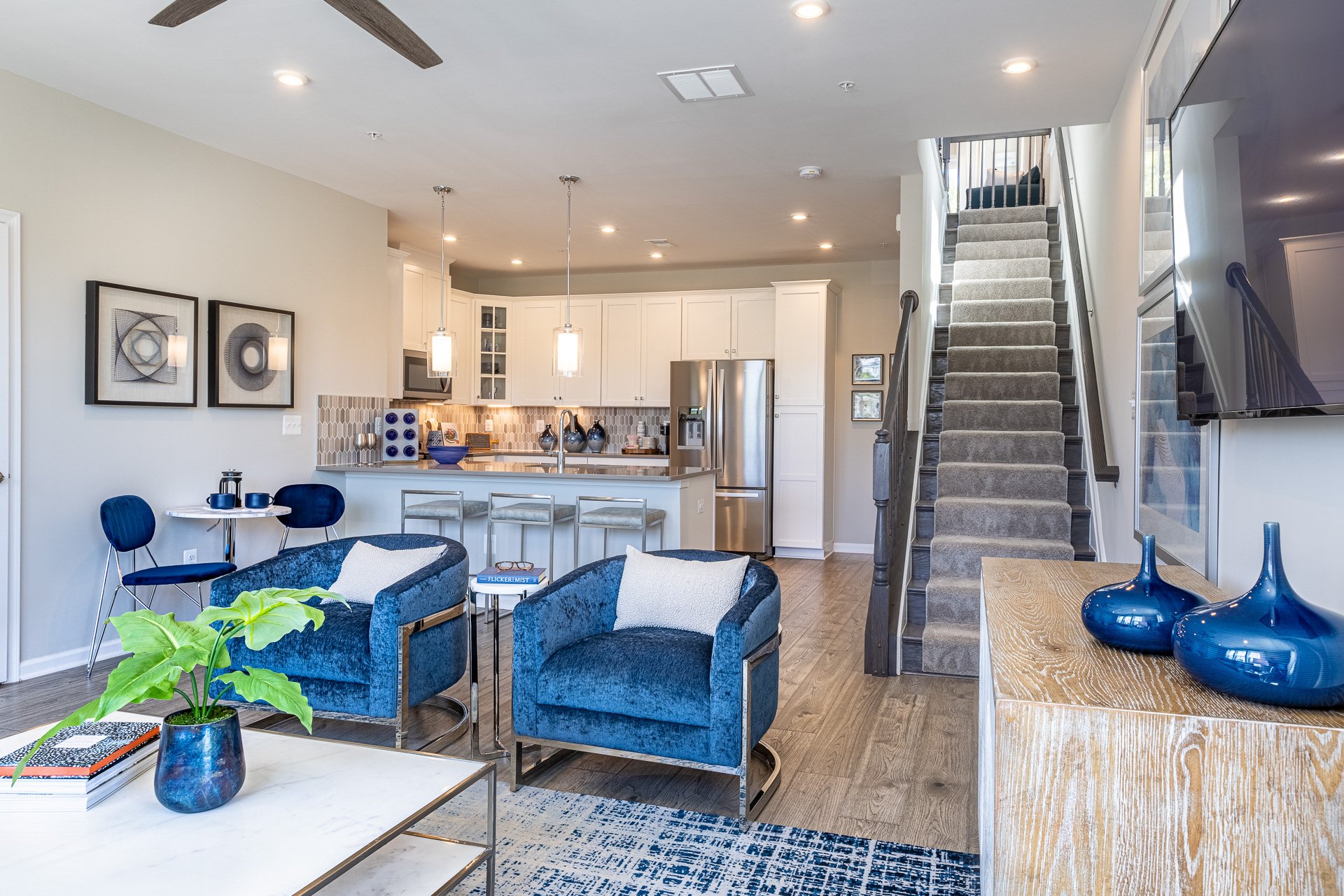 great room with two blue chairs