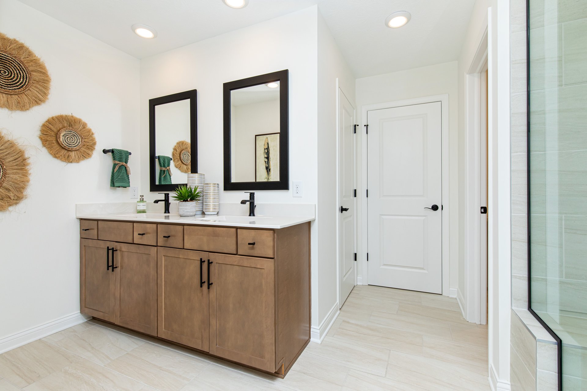 bathroom with wood vanity that has dual sinks