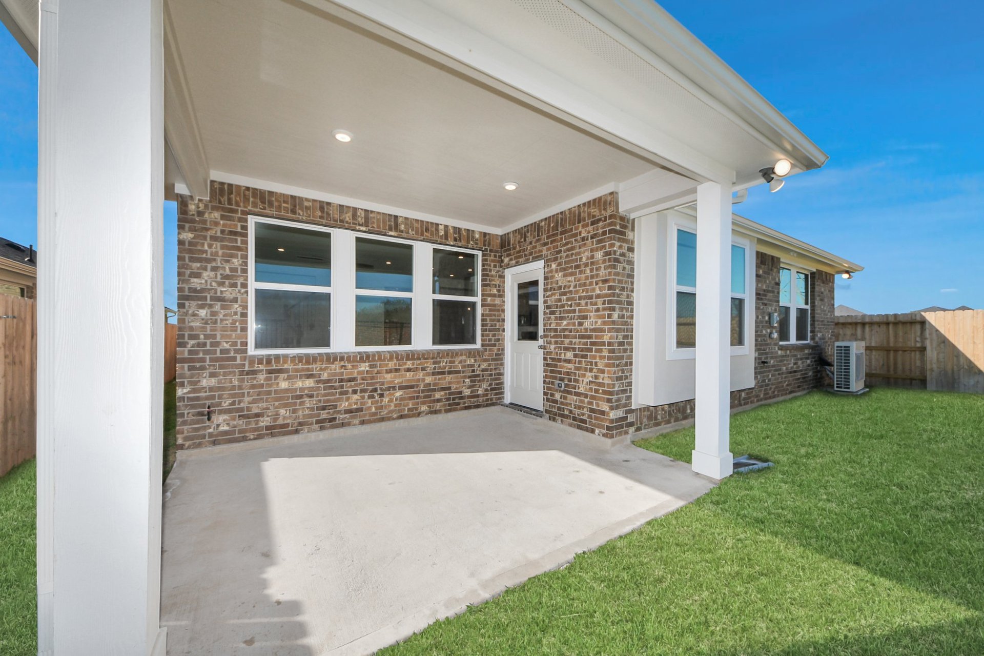 Cover patio with greenary view.