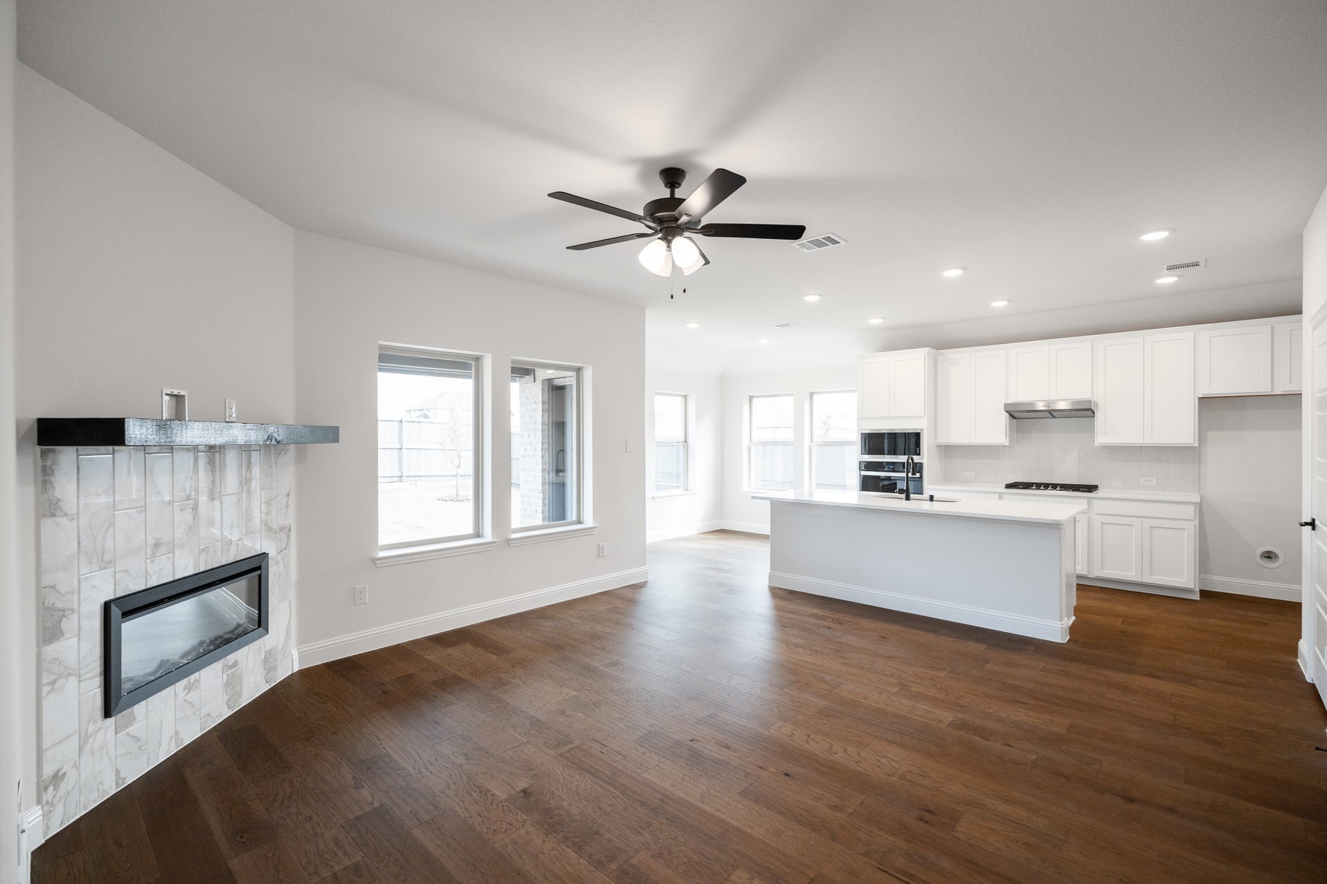 great room with fireplace and hard wood floors