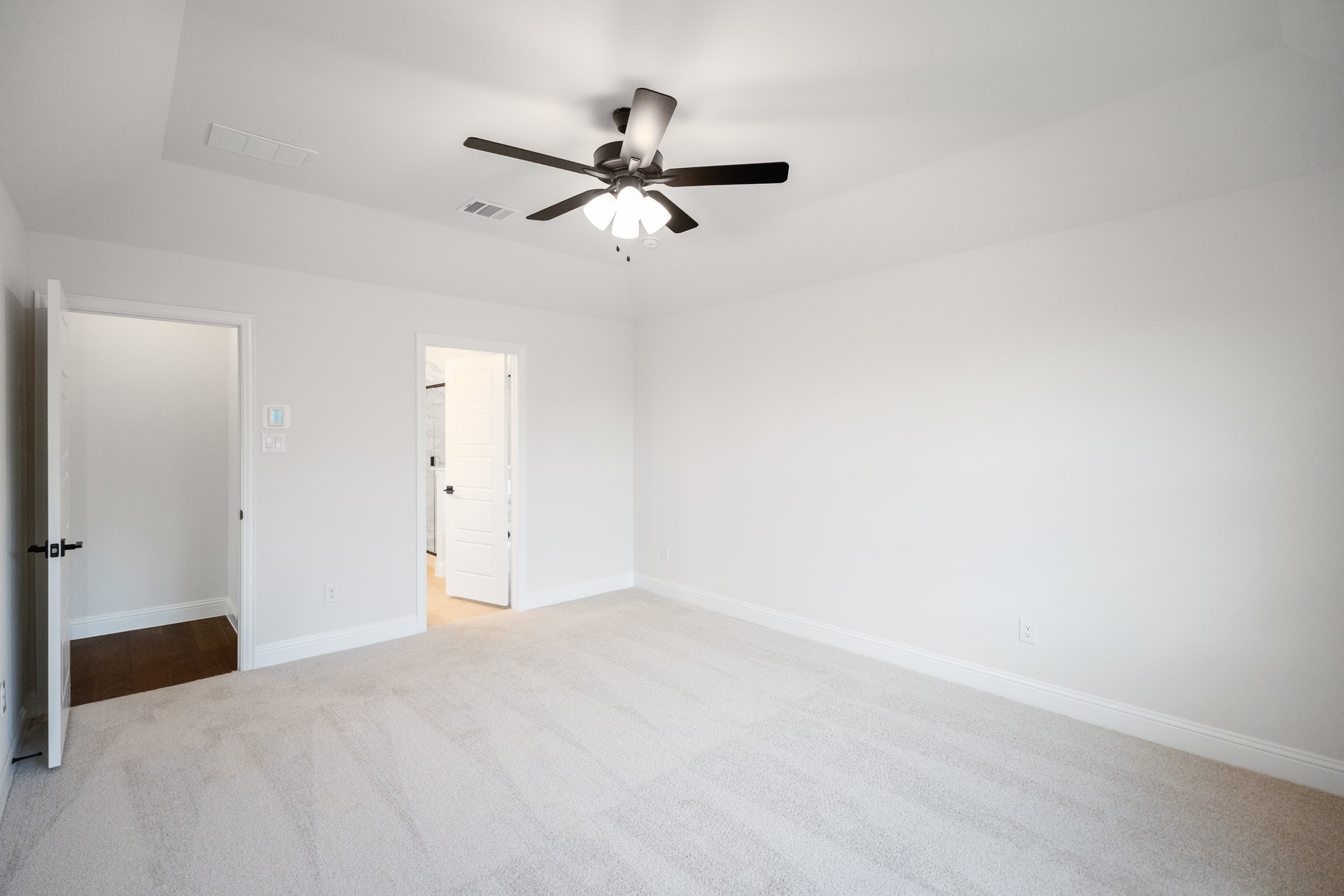 primary bedroom with carpet