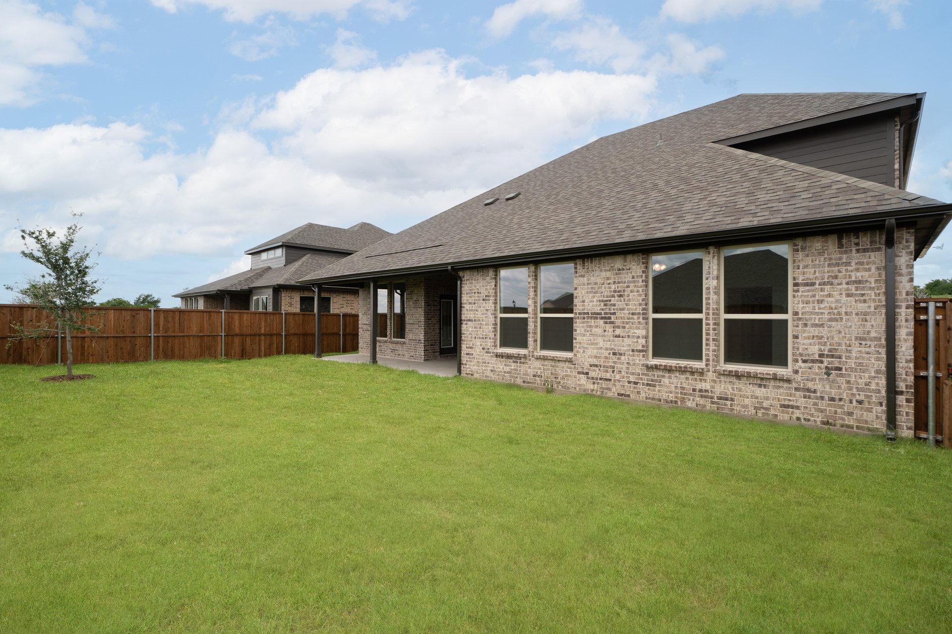backyard with grass and covered patio