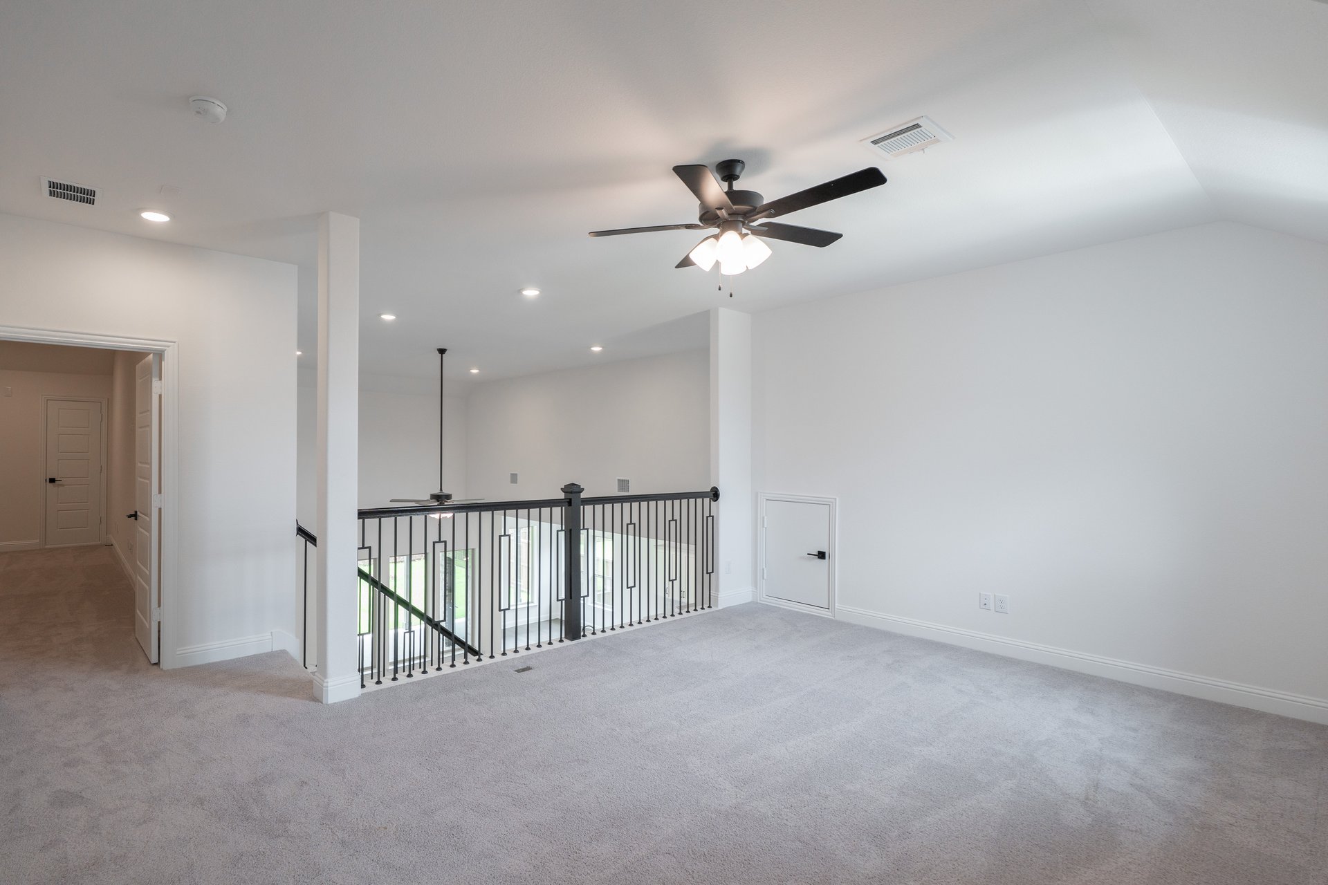 open gameroom with carpet and ceiling fan