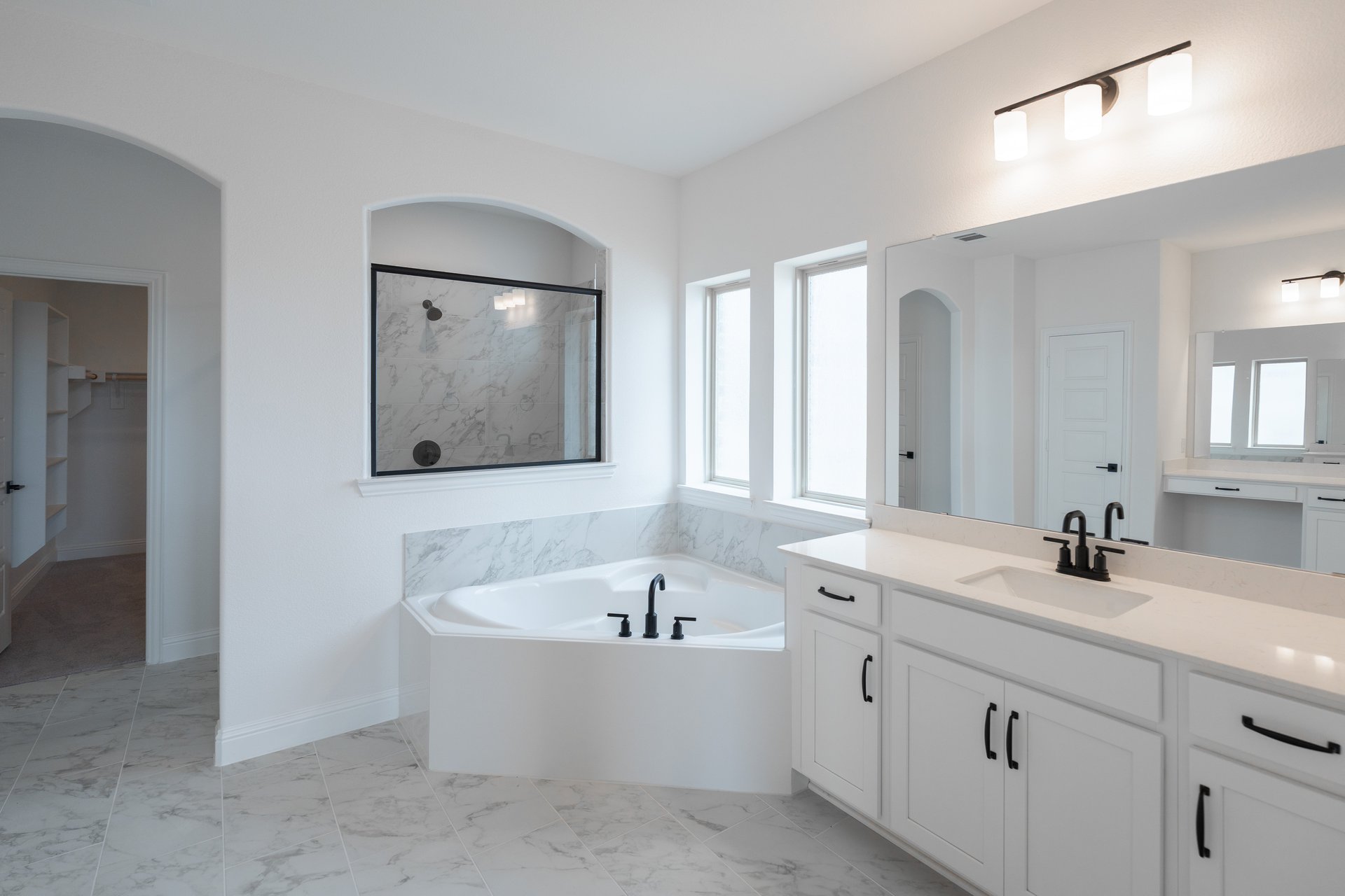  primary bathroom with soaking tub and walk-in shower