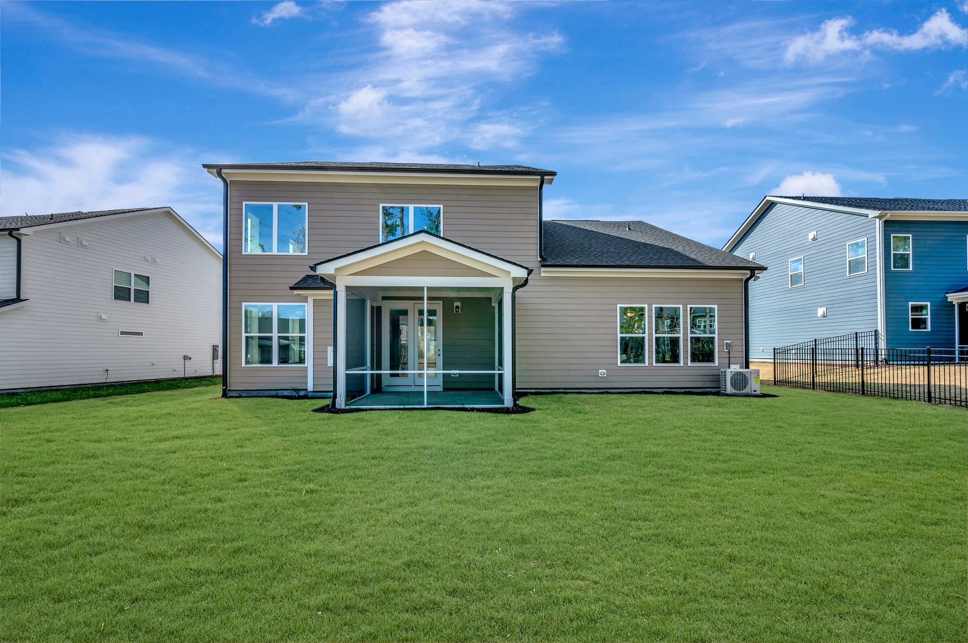 two-story single-family home rear exterior with a screened porch