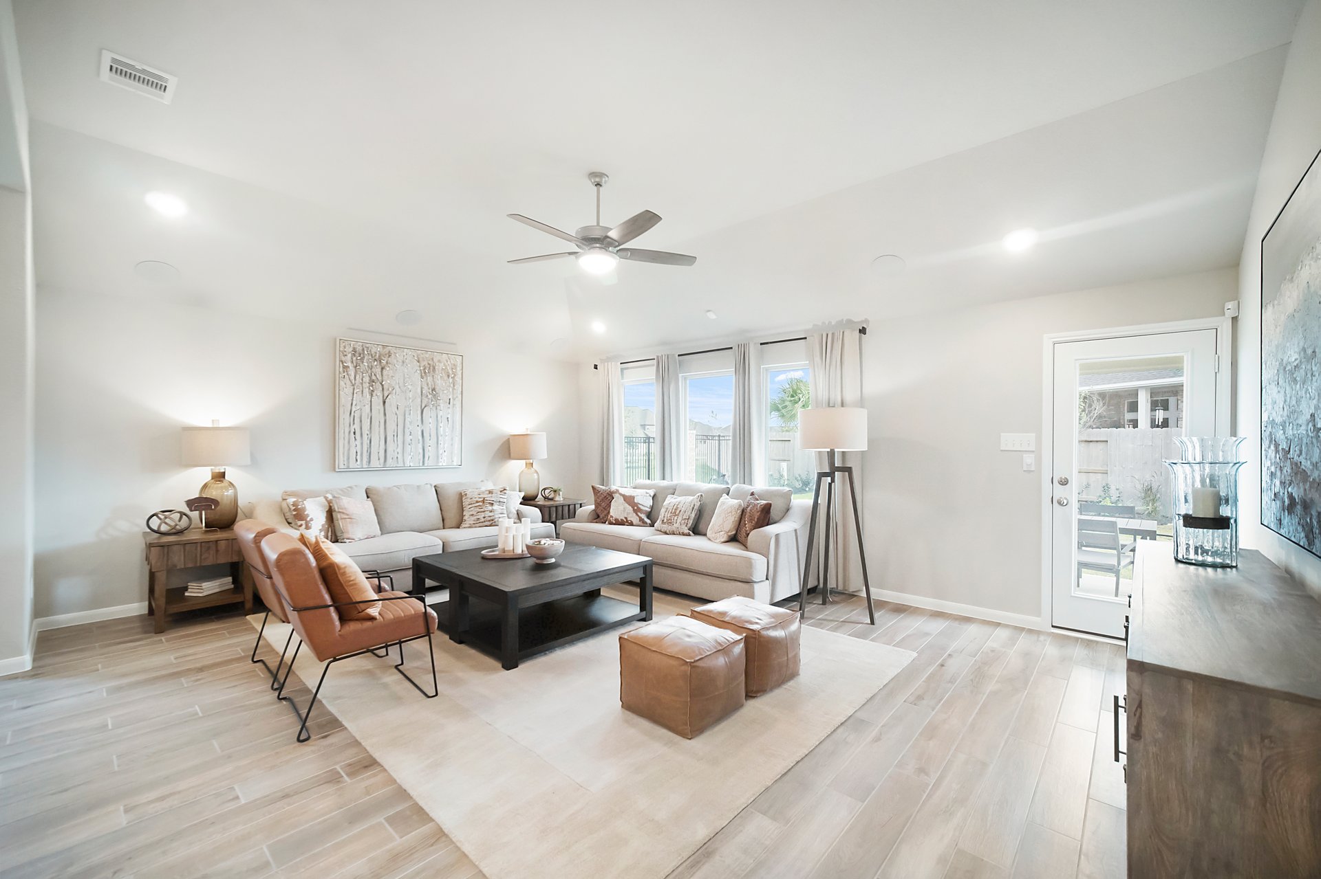 great room with ceiling fan