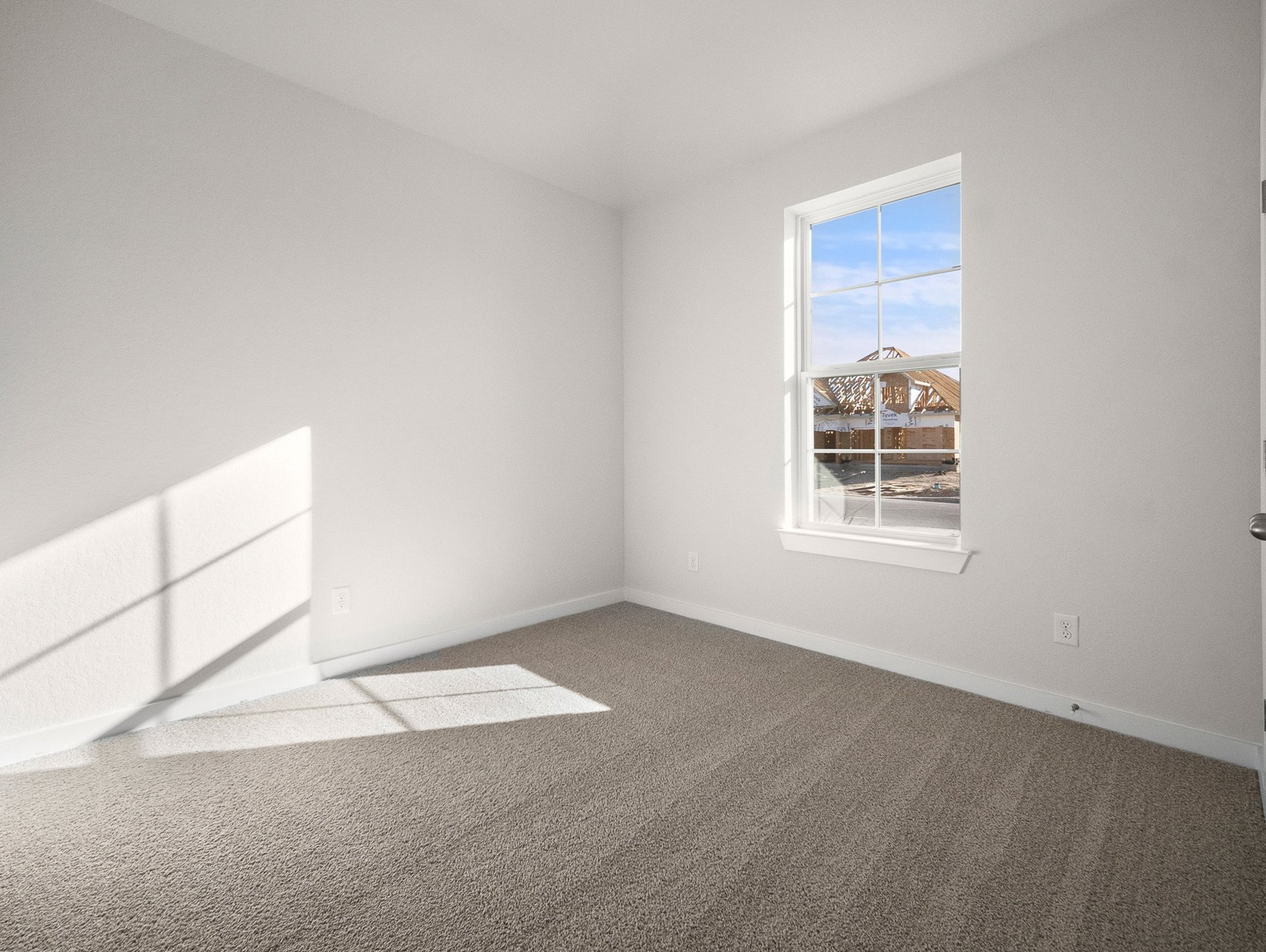 bedroom with carpet, window & a ceiling fan