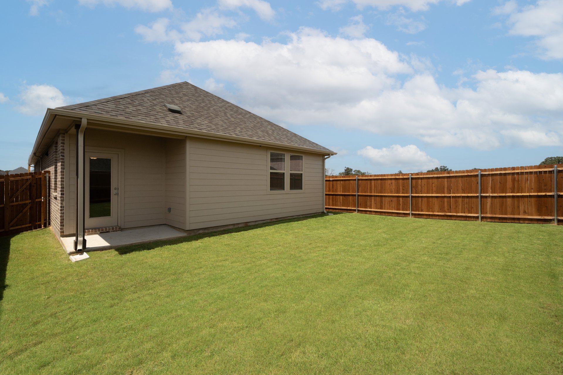  covered patio that opens up to fenced backyard 