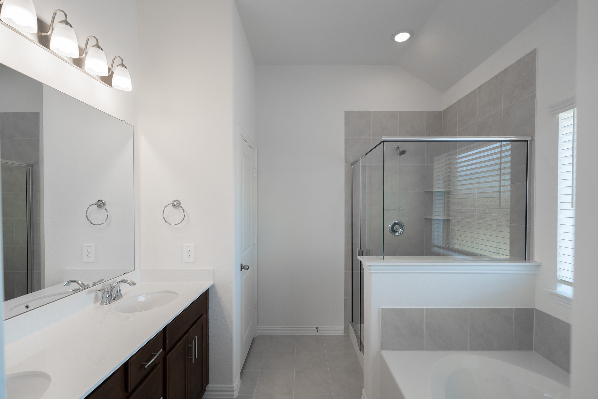 bathroom with tub and walk-in shower