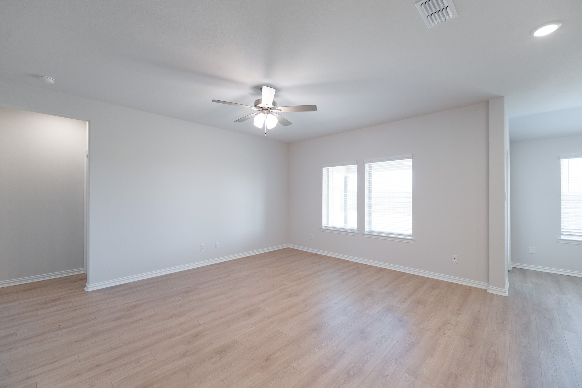 great room with wood floors