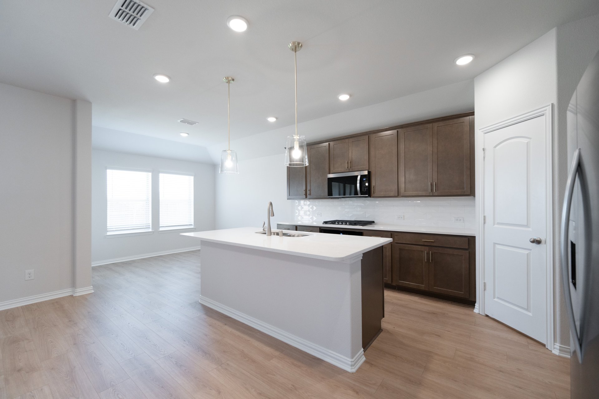 kitchen with open concept and brown cabinets