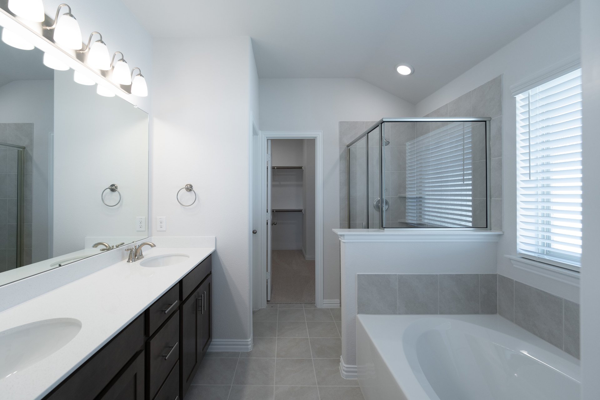 primary bathroom with shower and tub