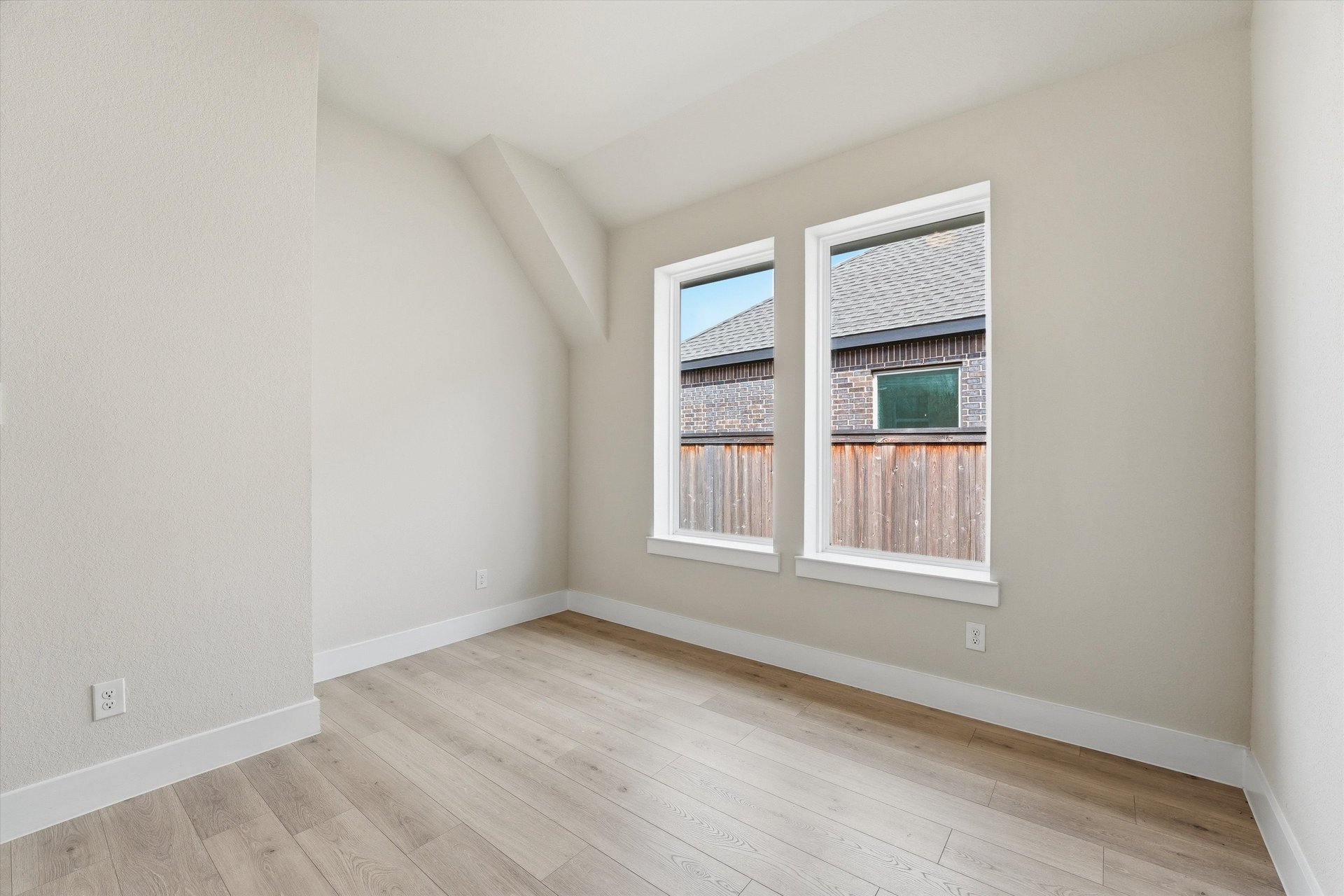 private study with hardwood flooring