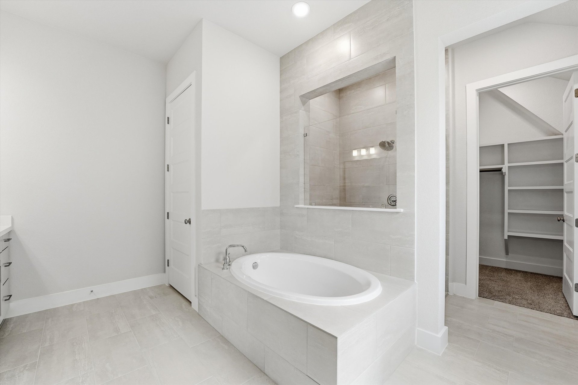 primary bathroom with soaking tub and walk-in shower
