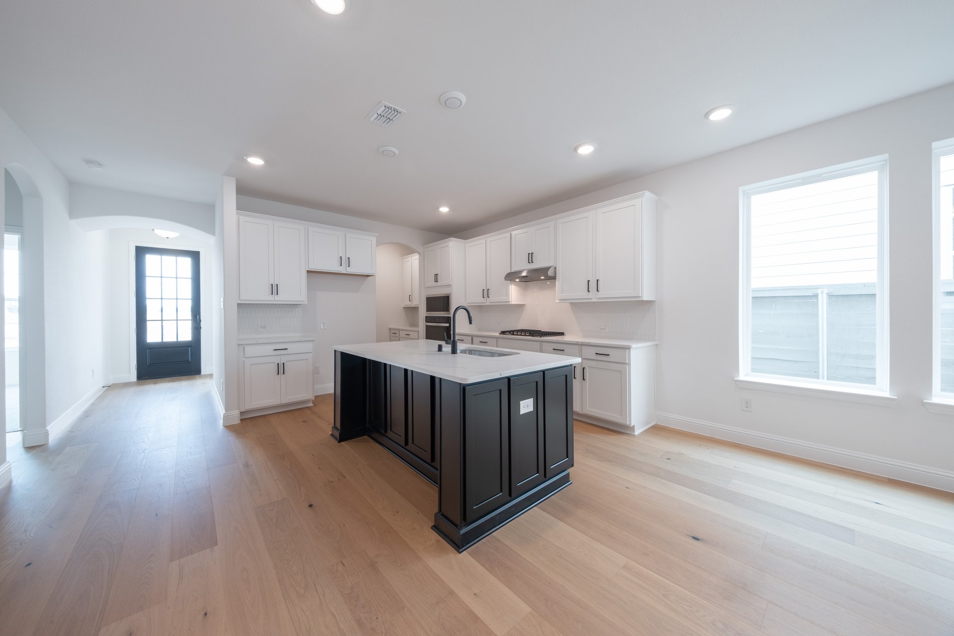 open kitchen with hardwood flooring