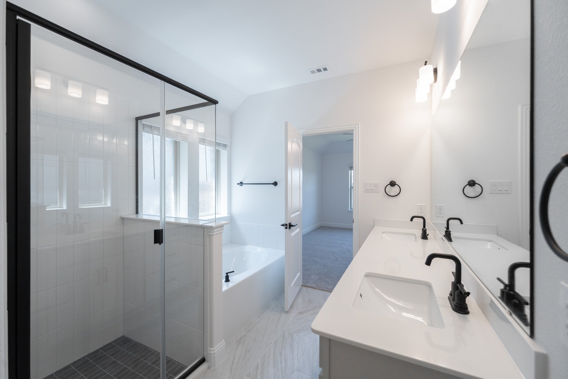 primary bathroom with soaking tub and walk-in shower