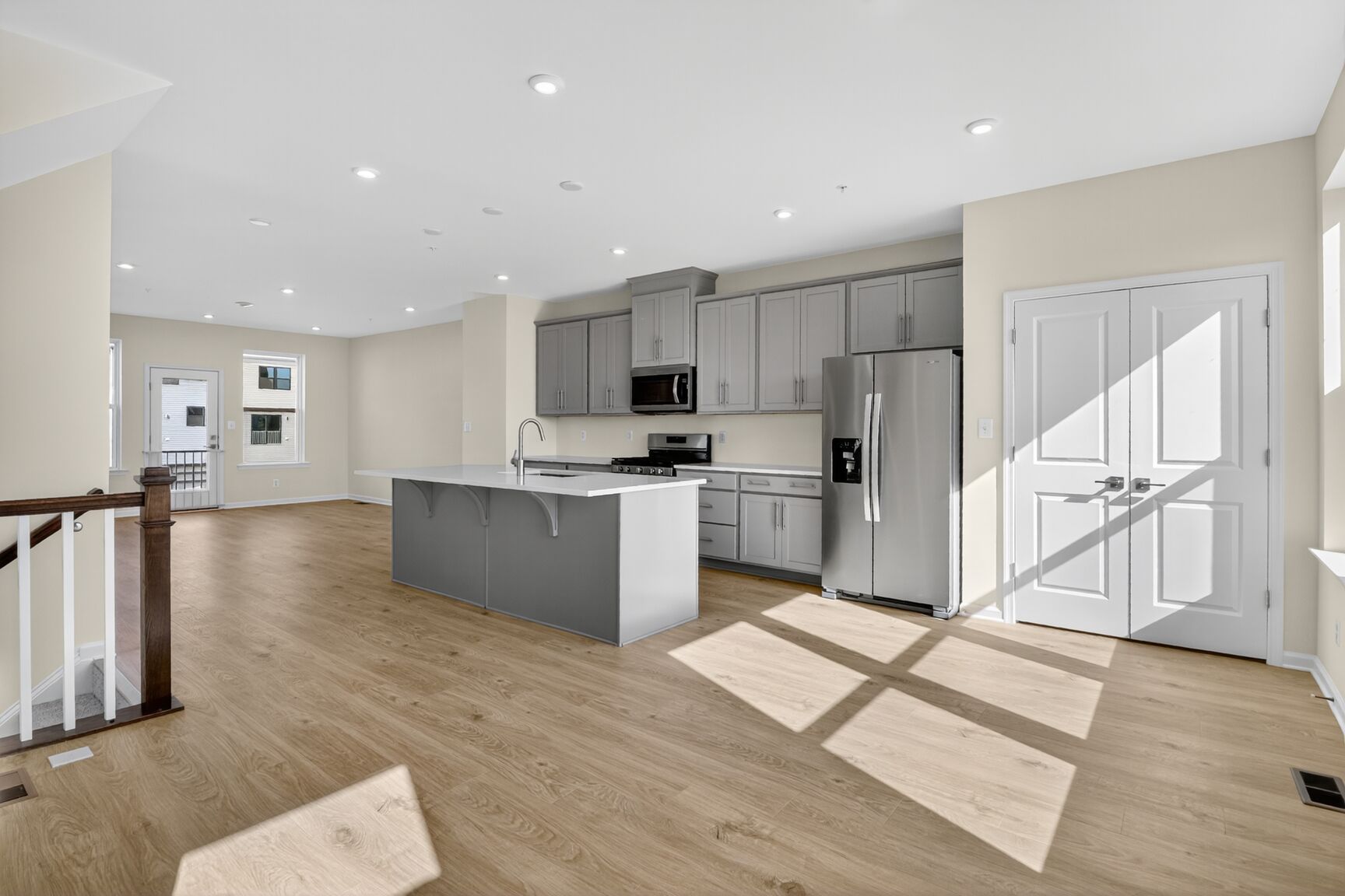 open dining area connects to the kitchen with designer floors