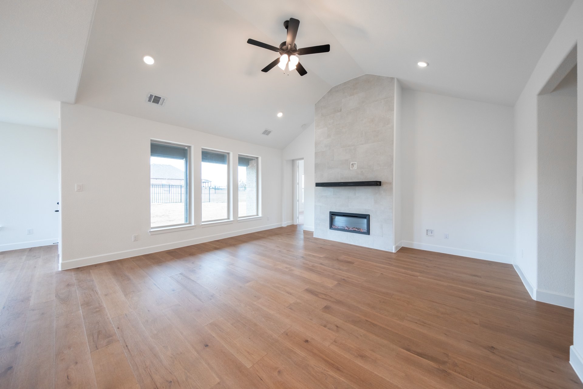 great room with fireplace and hard wood flooring