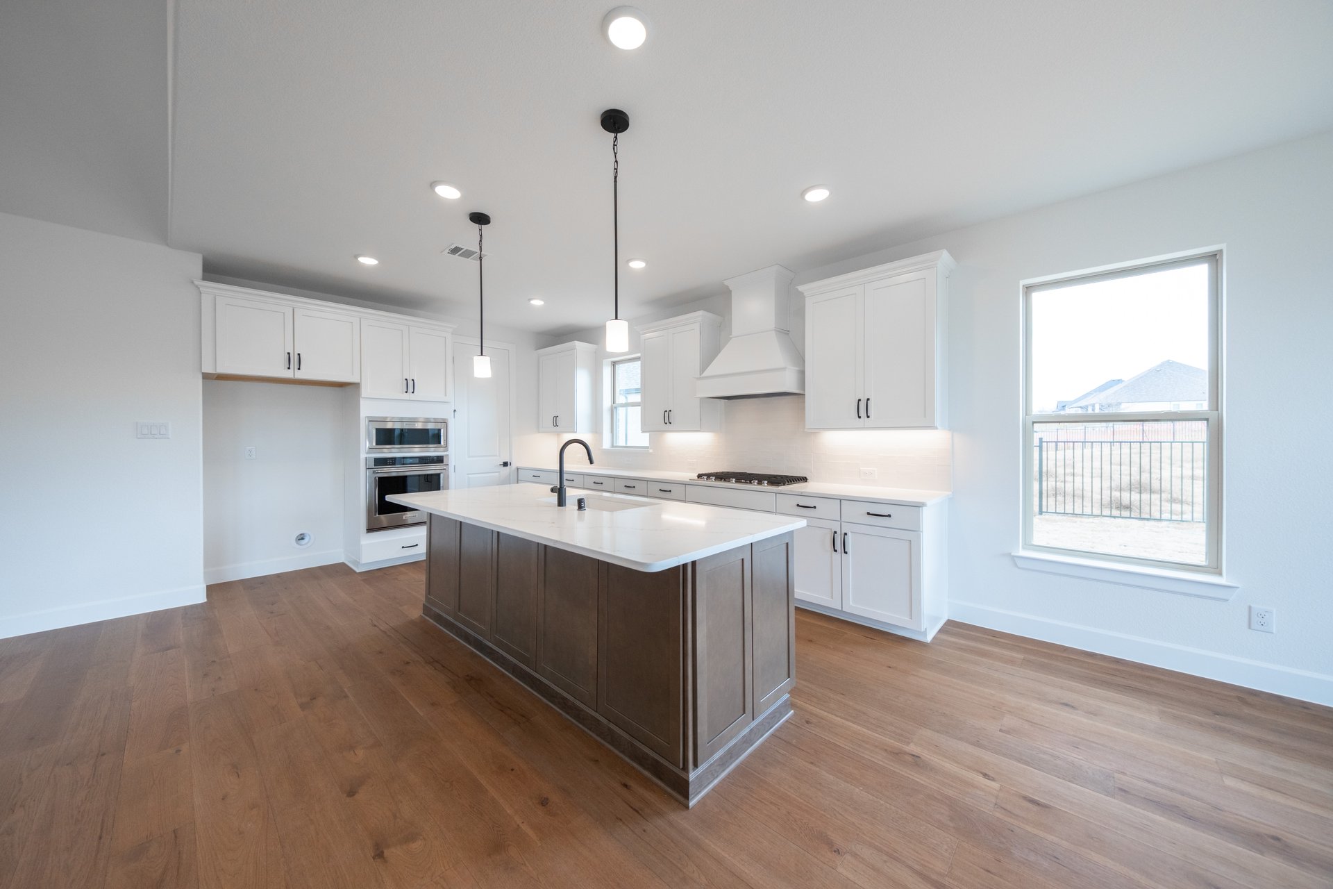 open concept kitchen with hard wood flooring