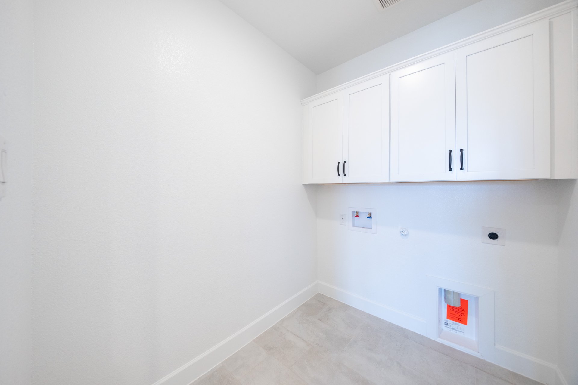 laundry room with tile flooring