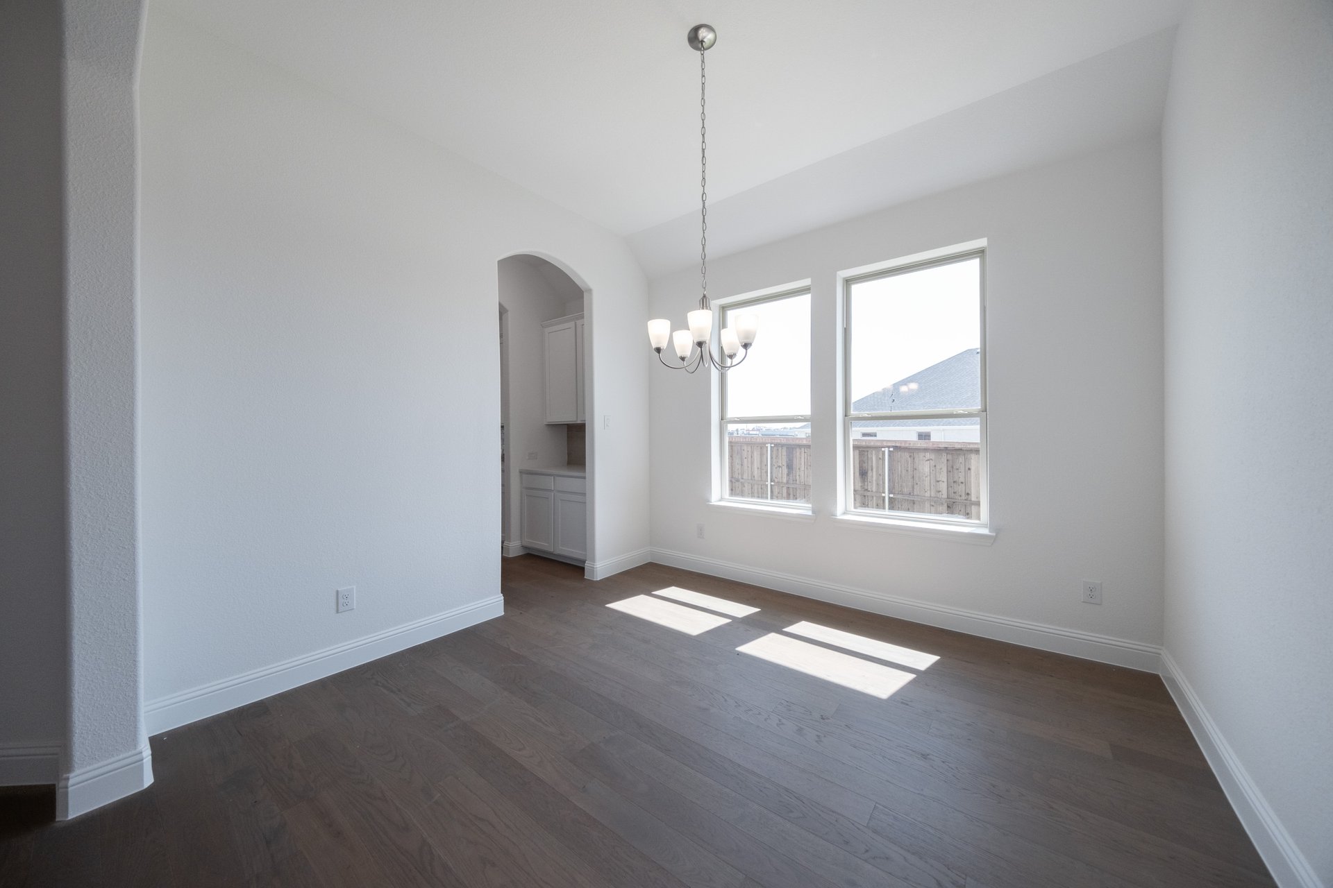 open dining room with hardwood flooring