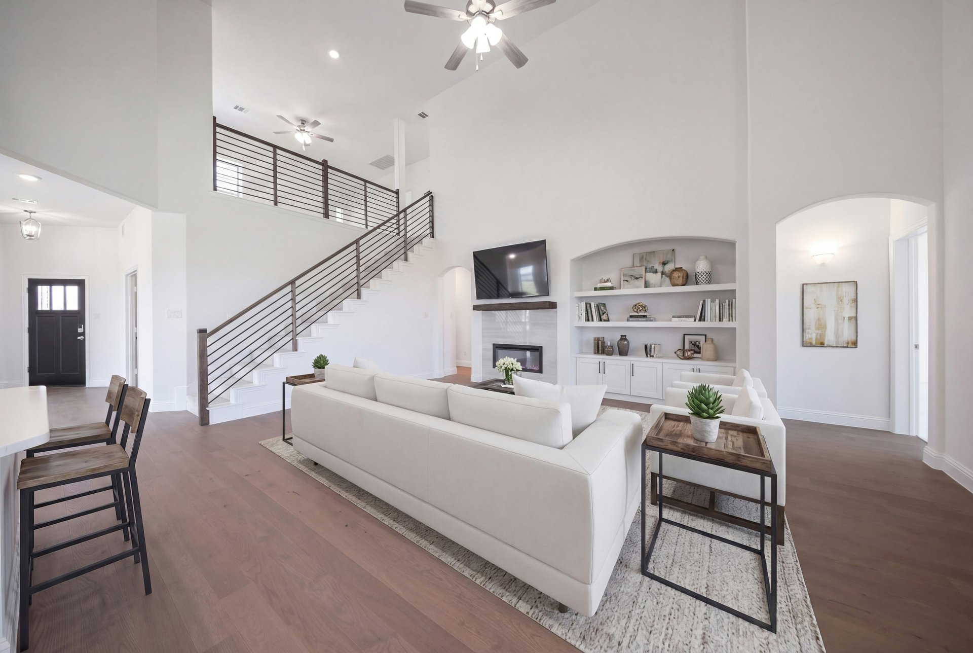 open great room with wood floors and fireplace