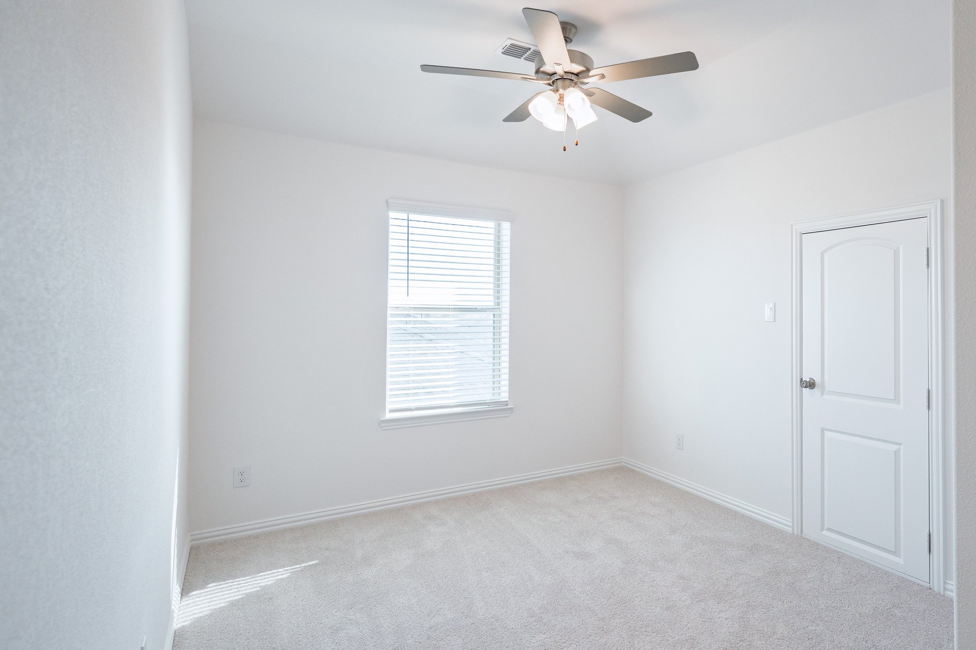 game room with carpet and ceiling fan