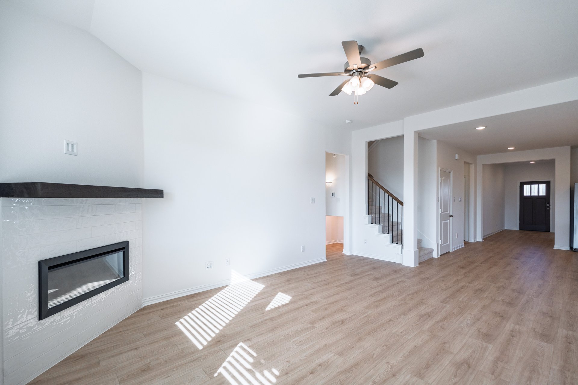 great room with fireplace and hard wood flooring