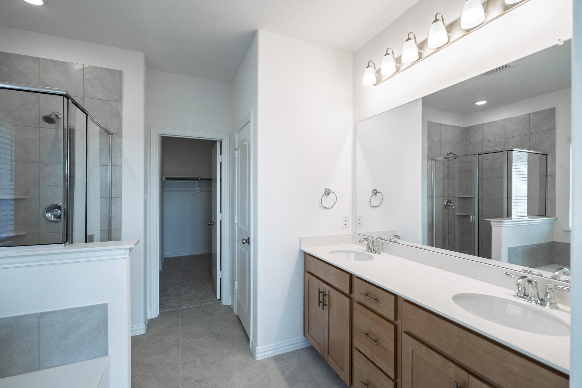 primary bathroom with shower and tub