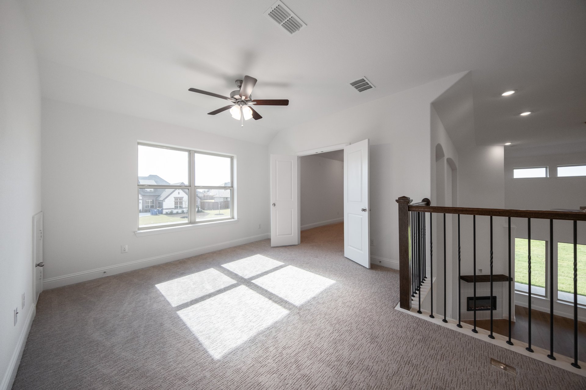 game room with large window and carpet 