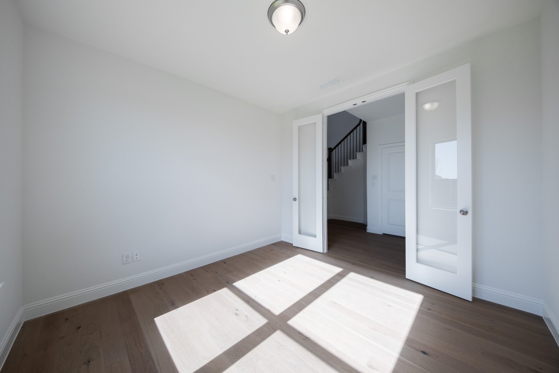 study with wood floors and french doors 