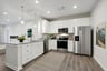 kitchen with white cabinets and pendant lighting