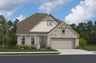home with brick, windows, garage and landscaped grass 