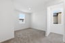 loft with tan carpet, white walls, window, and recessed ceiling light