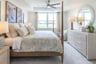 primary suite with a king-sized bed