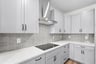 kitchen with white countertops and gray cabinets