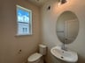 powder room with a pedestal sink