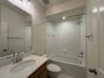 secondary bathroom with a shower and tub combo