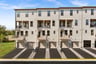 rear exterior of 2-story stacked townhome