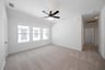 spacious game room with carpet
