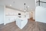 open kitchen with white cabinets