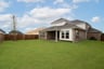 backyard with grass and covered patio