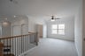 open gameroom with carpet and ceiling fan
